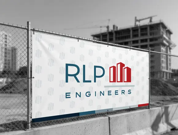 RLP Engineers banner on construction site fence